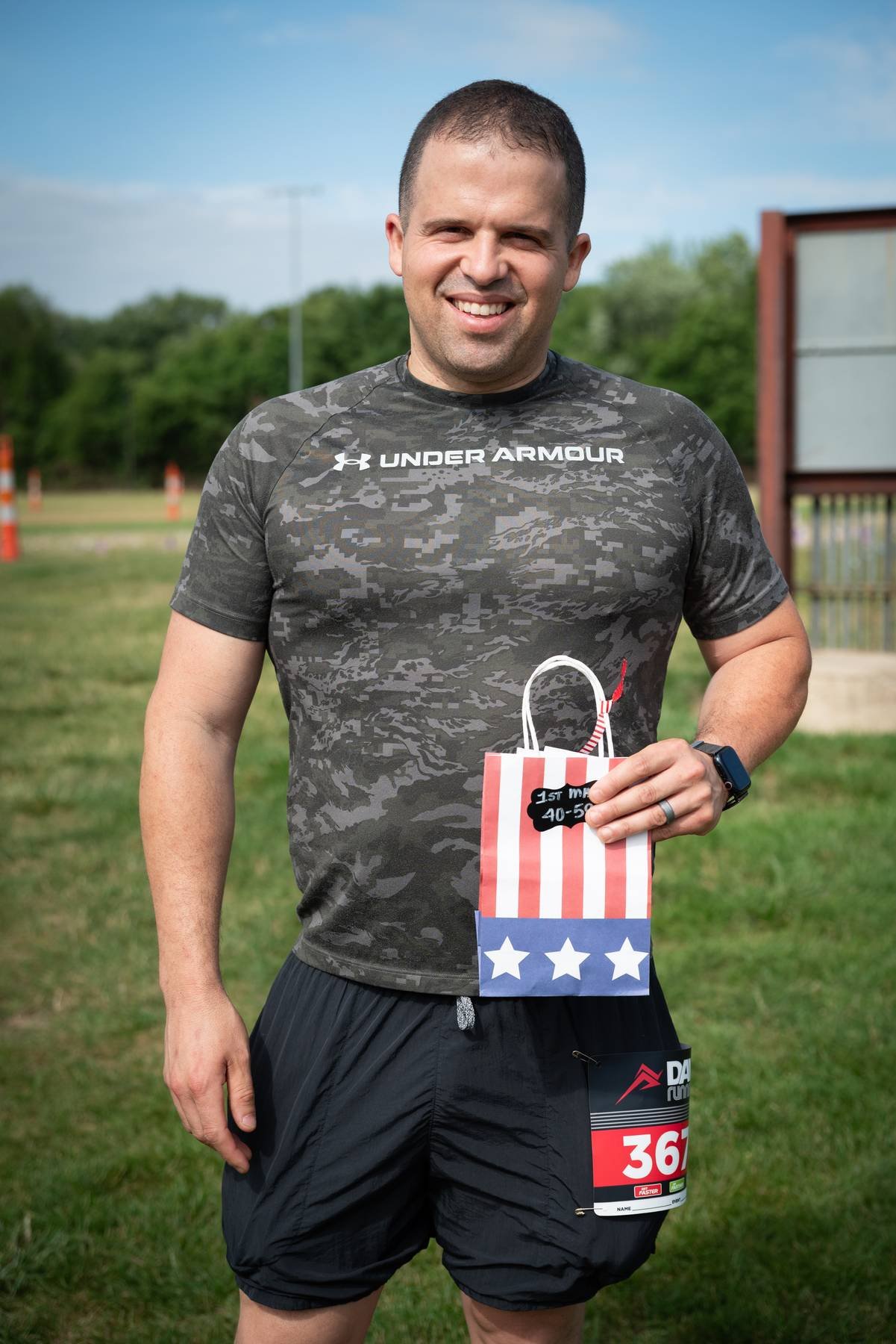 Runner with a finisher medal at a Toledo area 5k